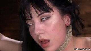 Brunette goth babe Charlotte Sartre pussy rubbed in an eagle standing bondage